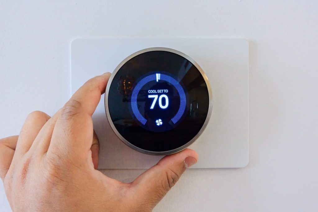Smart thermostat calibrated for San Diego Time-of-Use rates to optimize air conditioning installation efficiency.